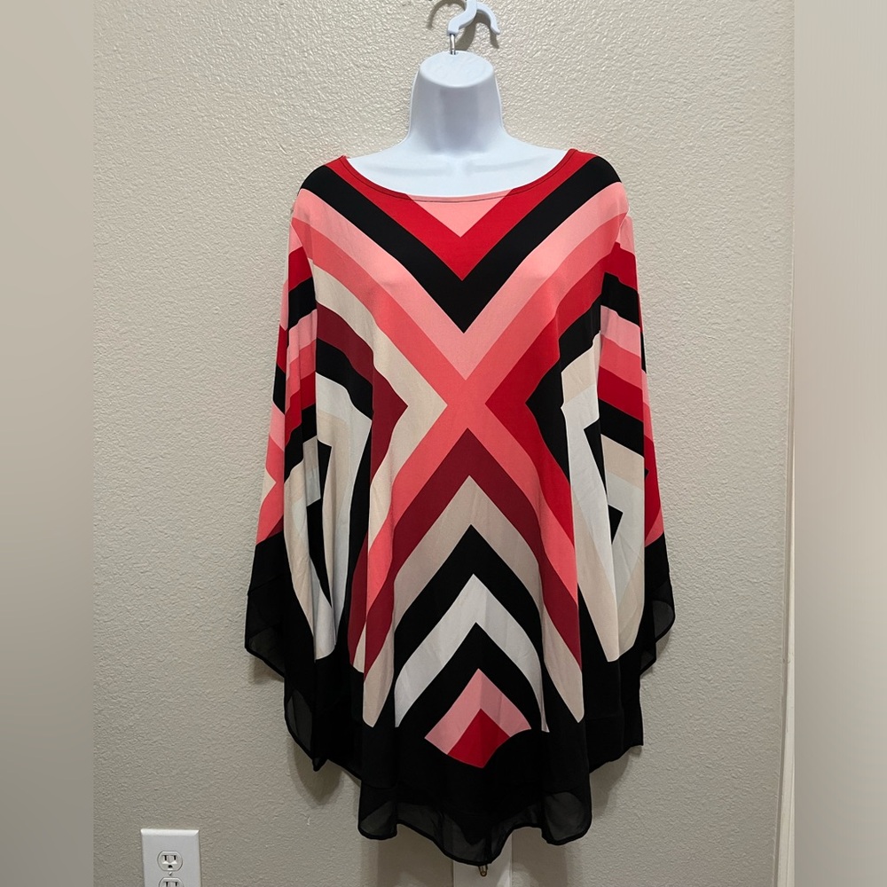 Women’s blouse , Size 3X , with pink ,red, white and blackl stripes.